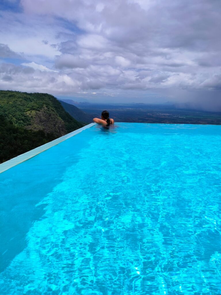 hills view from swimming pool area at Hills and hues resort, thekkady